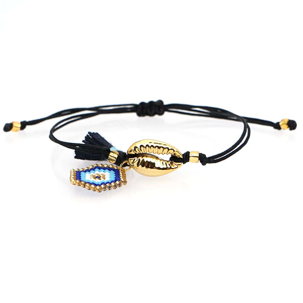 Snäckarmband Gyllene Kaurisnäcka Och Blå Ögon